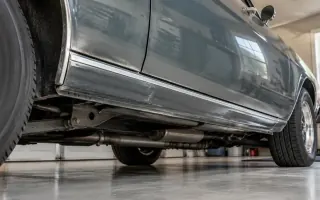 Underside of a classic car with clean wheel wells and rocker panels in a dry garage
