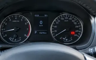 Dashboard battery warning light illuminated on a car instrument cluster